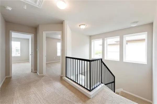 wooden floor in a hall with a window