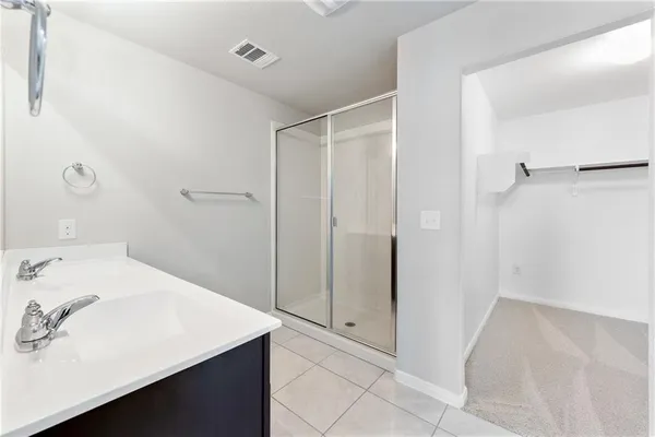 a bathroom with a sink and a shower