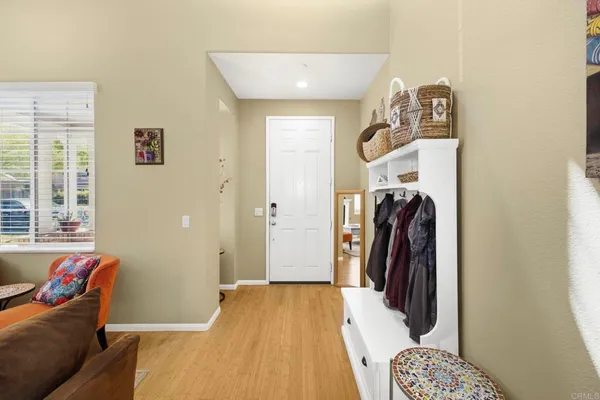 a view of a livingroom with furniture and a window