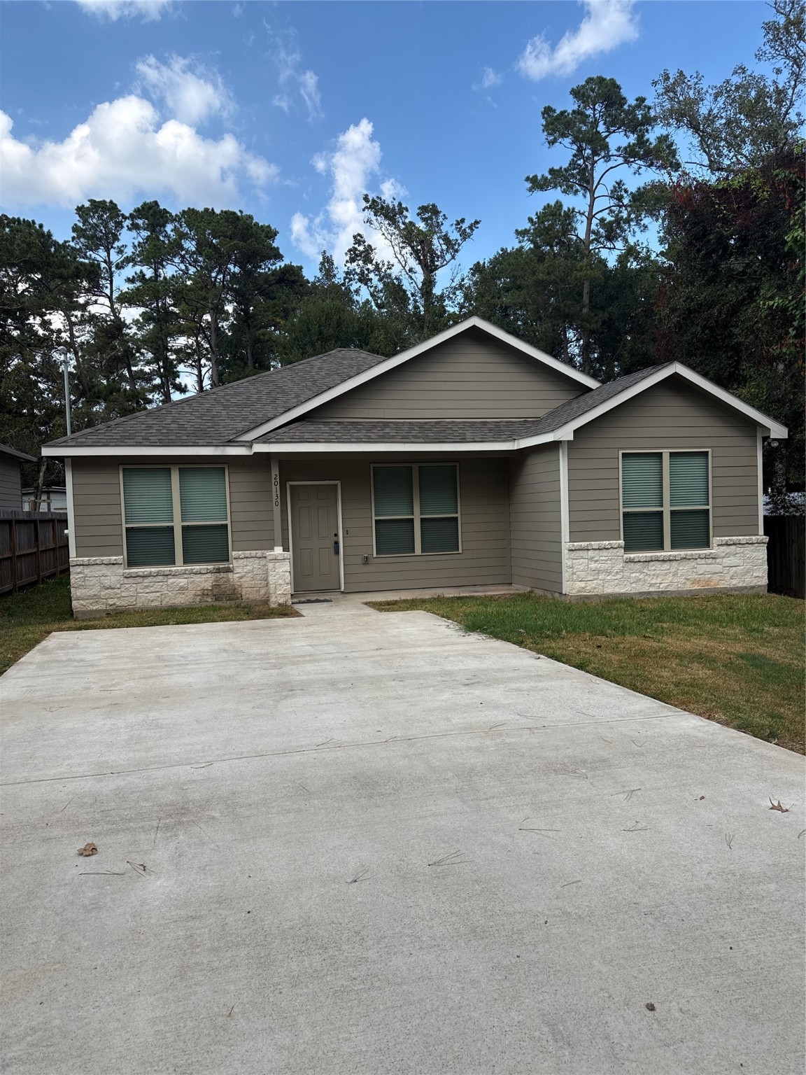 front view of a house with a yard