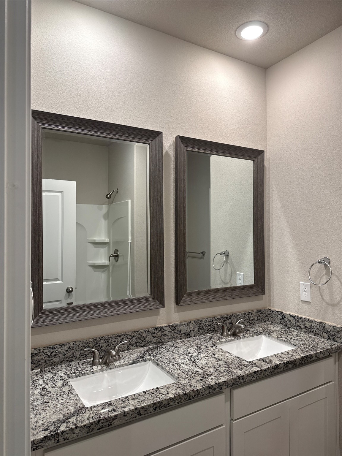 20130 Parkway Lane Montgomery, TX 77356 - Photo 11 of 18 a bathroom with a granite countertop sink and a mirror