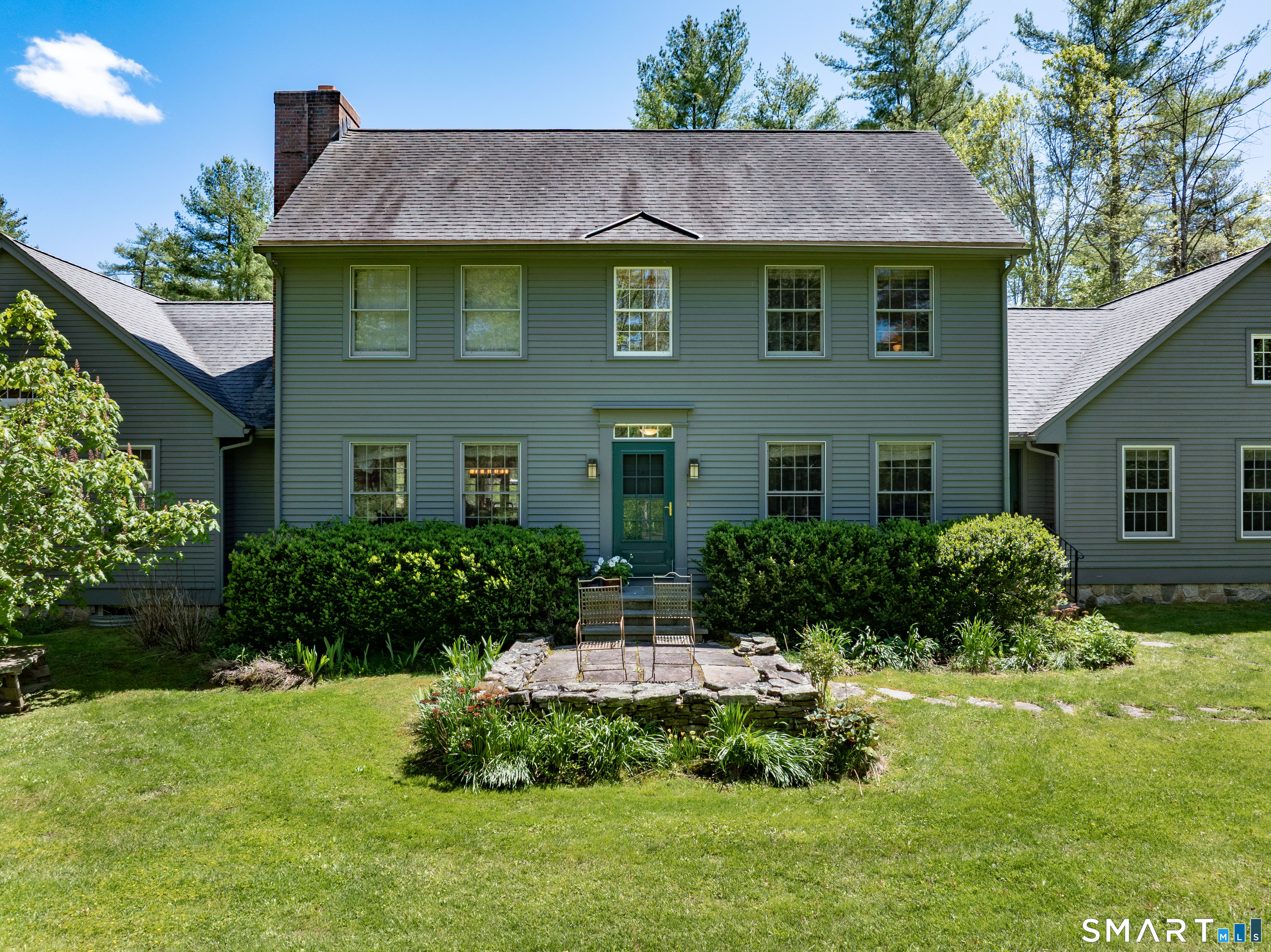 7 Cooper Hill Road Salisbury, CT 06068 - Photo 35 of 36 a front view of a house with a yard