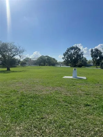 a view of a golf course with a lake