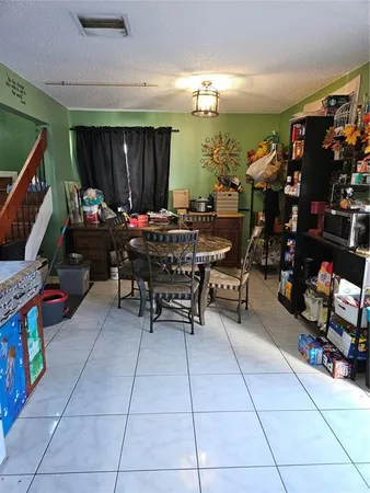 a living room with lots of furniture and a flat screen tv