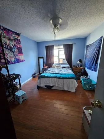 a bedroom with bed and window