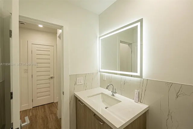 a bathroom with a sink and a mirror