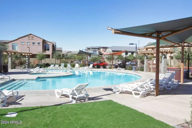 a view of a swimming pool with a patio