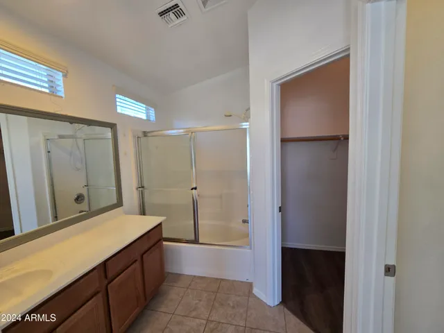 a bathroom with a tub and a sink