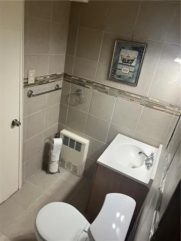 a bathroom with a toilet and a sink