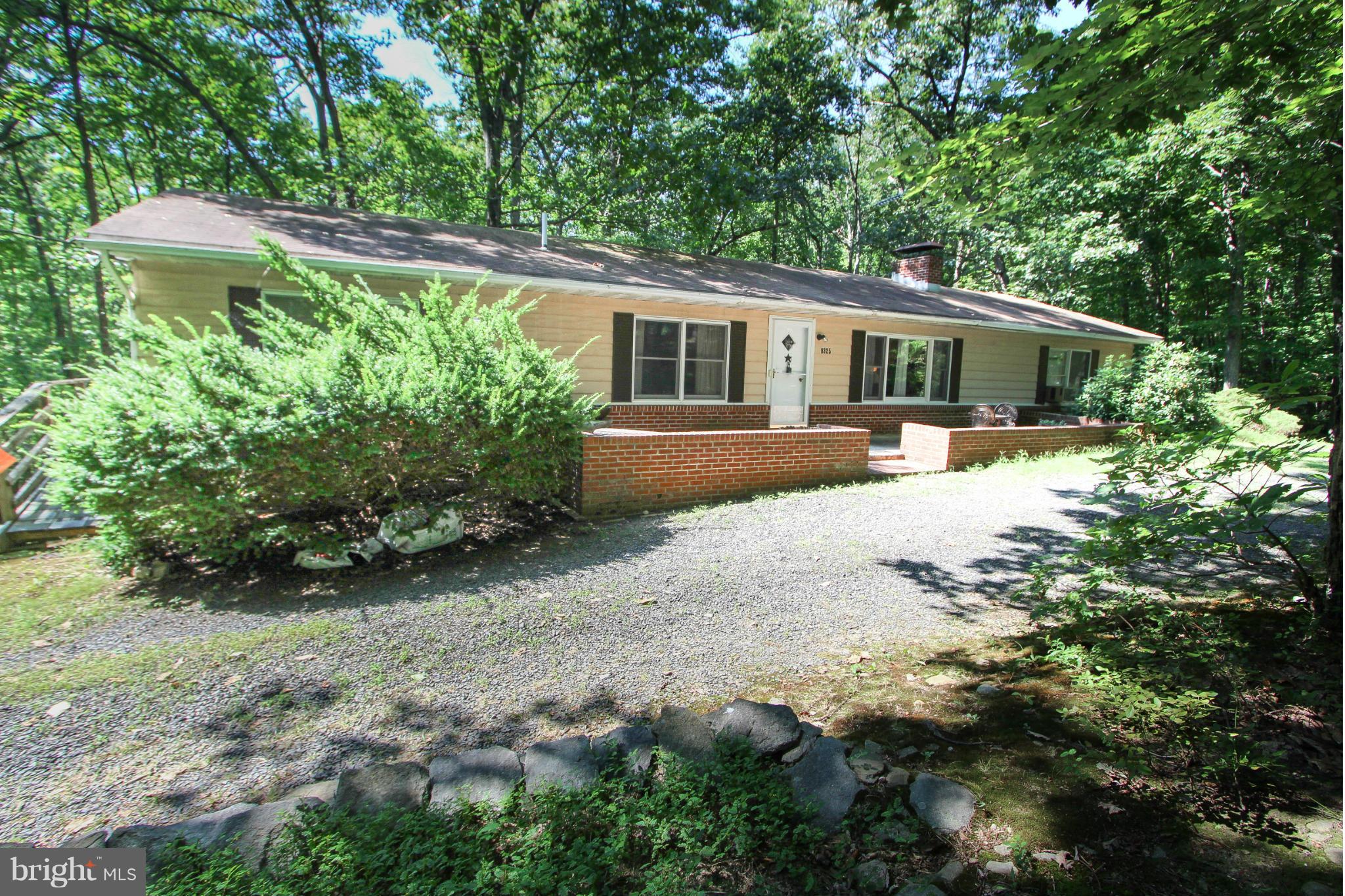9325 Mountjoy Road Marshall, VA 20115 - Photo 2 of 30 a front view of a house with a yard and shrubs