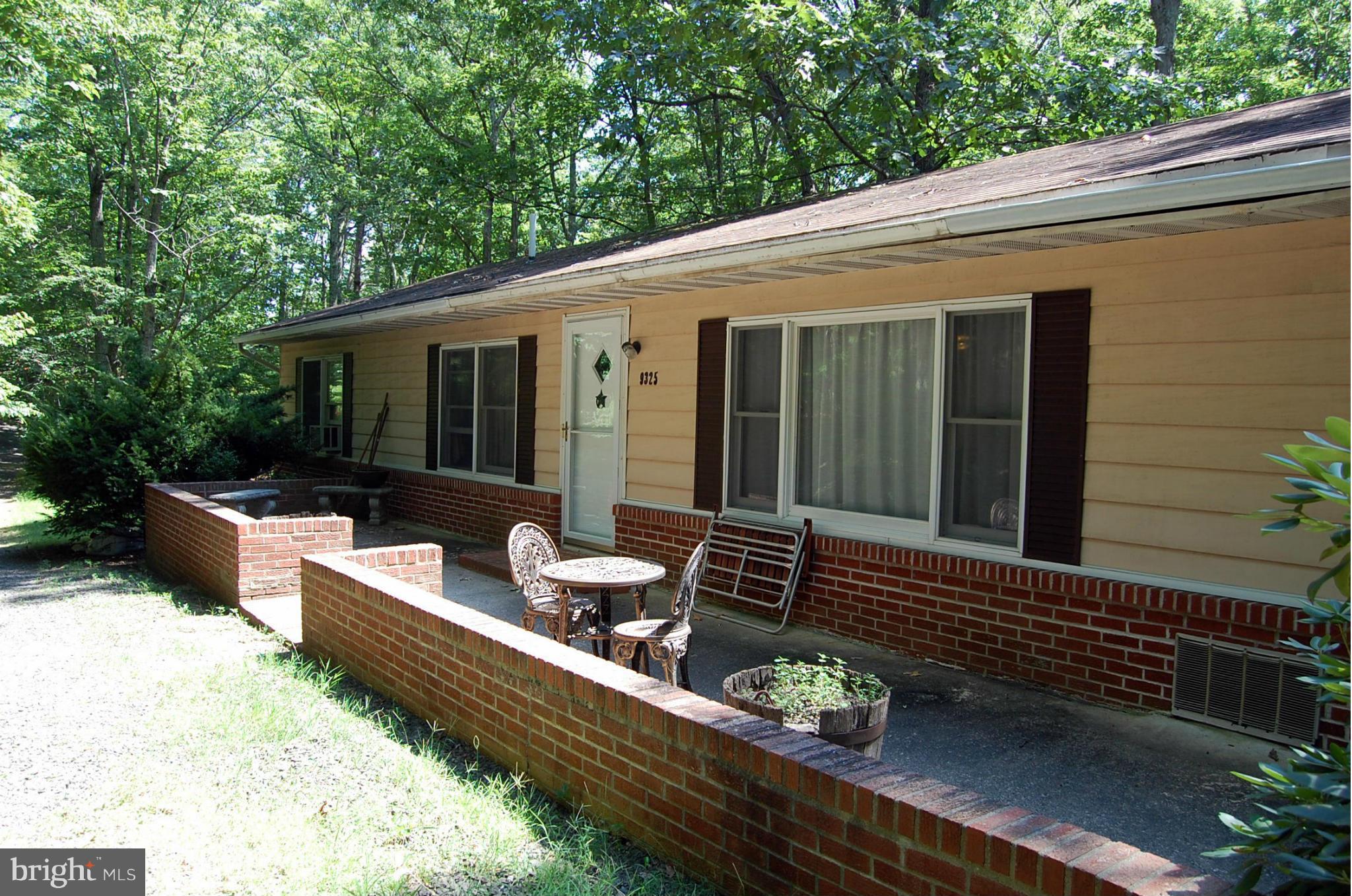 9325 Mountjoy Road Marshall, VA 20115 - Photo 3 of 30 a view of a patio with couches chairs and wooden floor