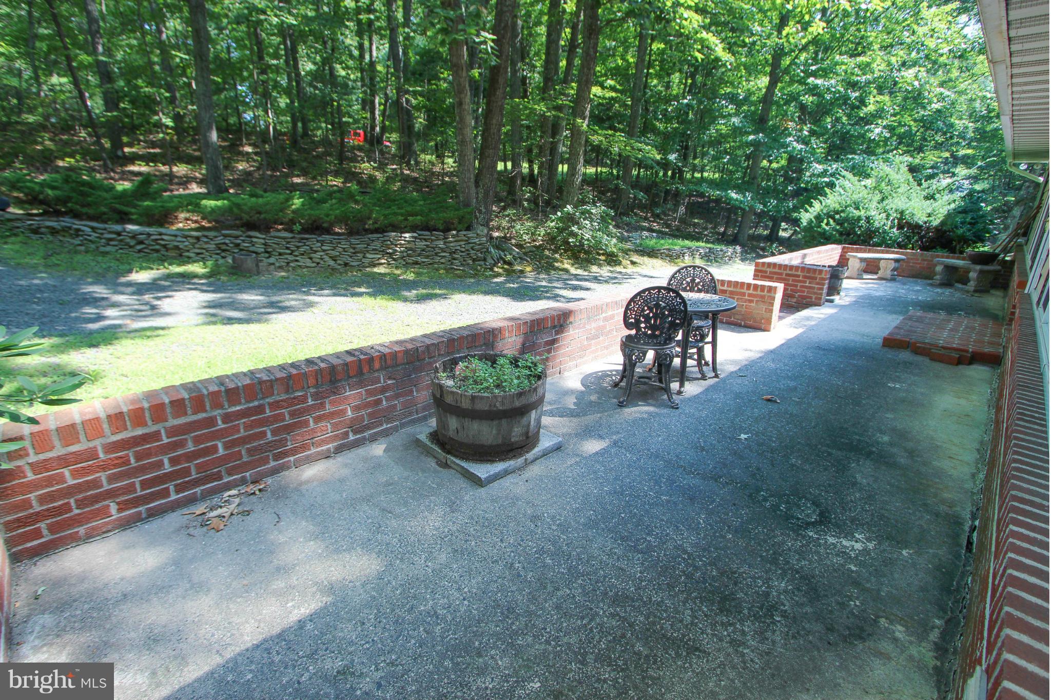 9325 Mountjoy Road Marshall, VA 20115 - Photo 4 of 30 a view of a patio with chairs and a table