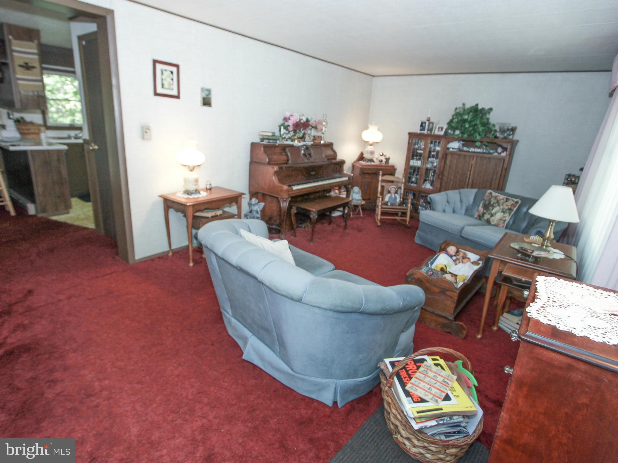 9325 Mountjoy Road Marshall, VA 20115 - Photo 7 of 30 a living room with furniture and a dining table