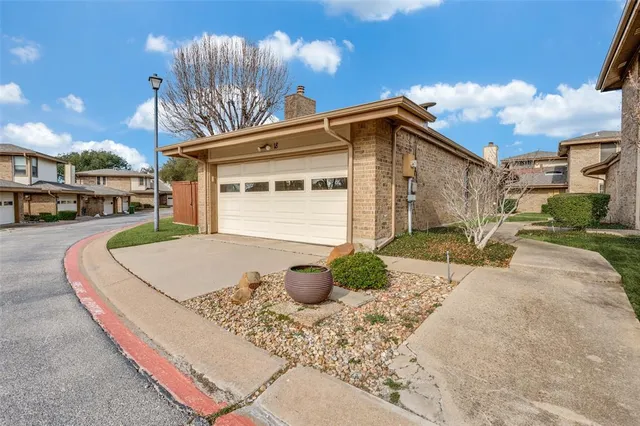 a view of a house with a snow in the background