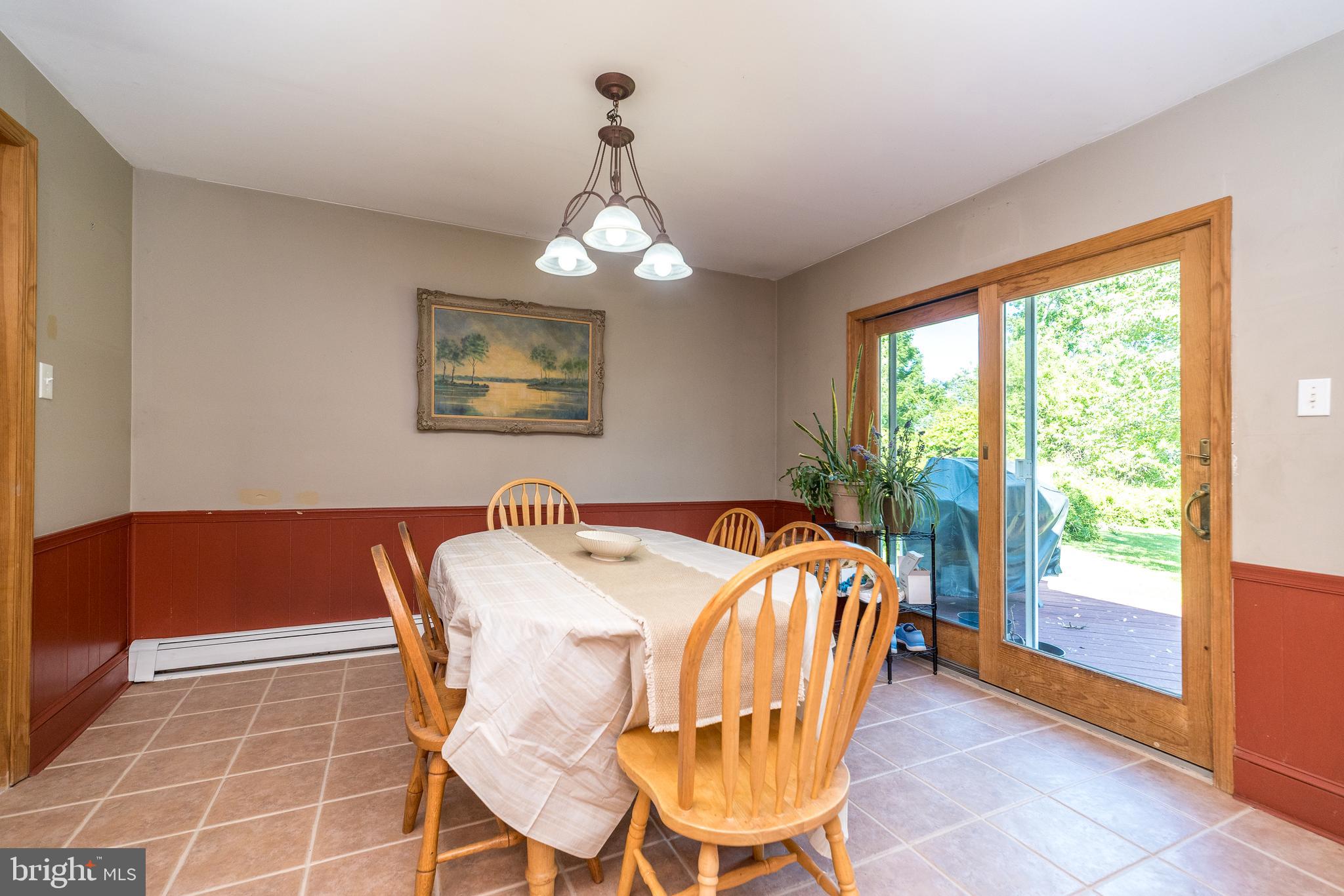 511 Upper Stump Road Chalfont, PA 18914 - Photo 19 of 37 Dining area with sliders to the deck