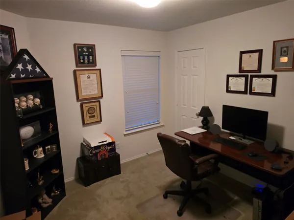 a view of a workspace with furniture