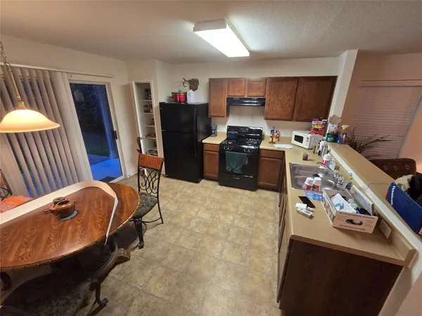 a bedroom with furniture and a flat screen tv