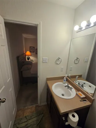a bathroom with a sink and mirror