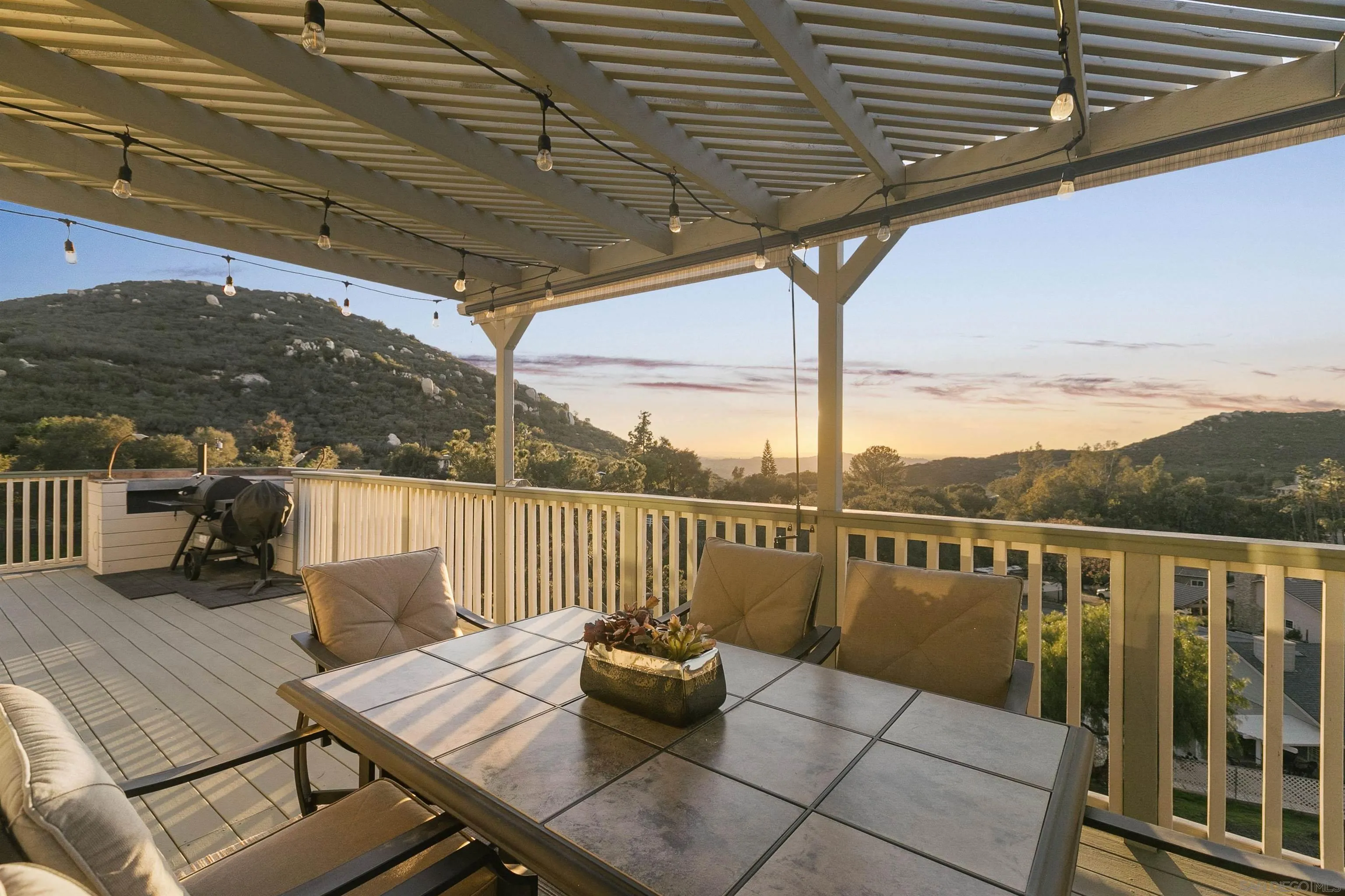 2505 Suncrest Boulevard El Cajon, CA 92021 - Photo 24 of 45 a view of a balcony with couches and wooden floor