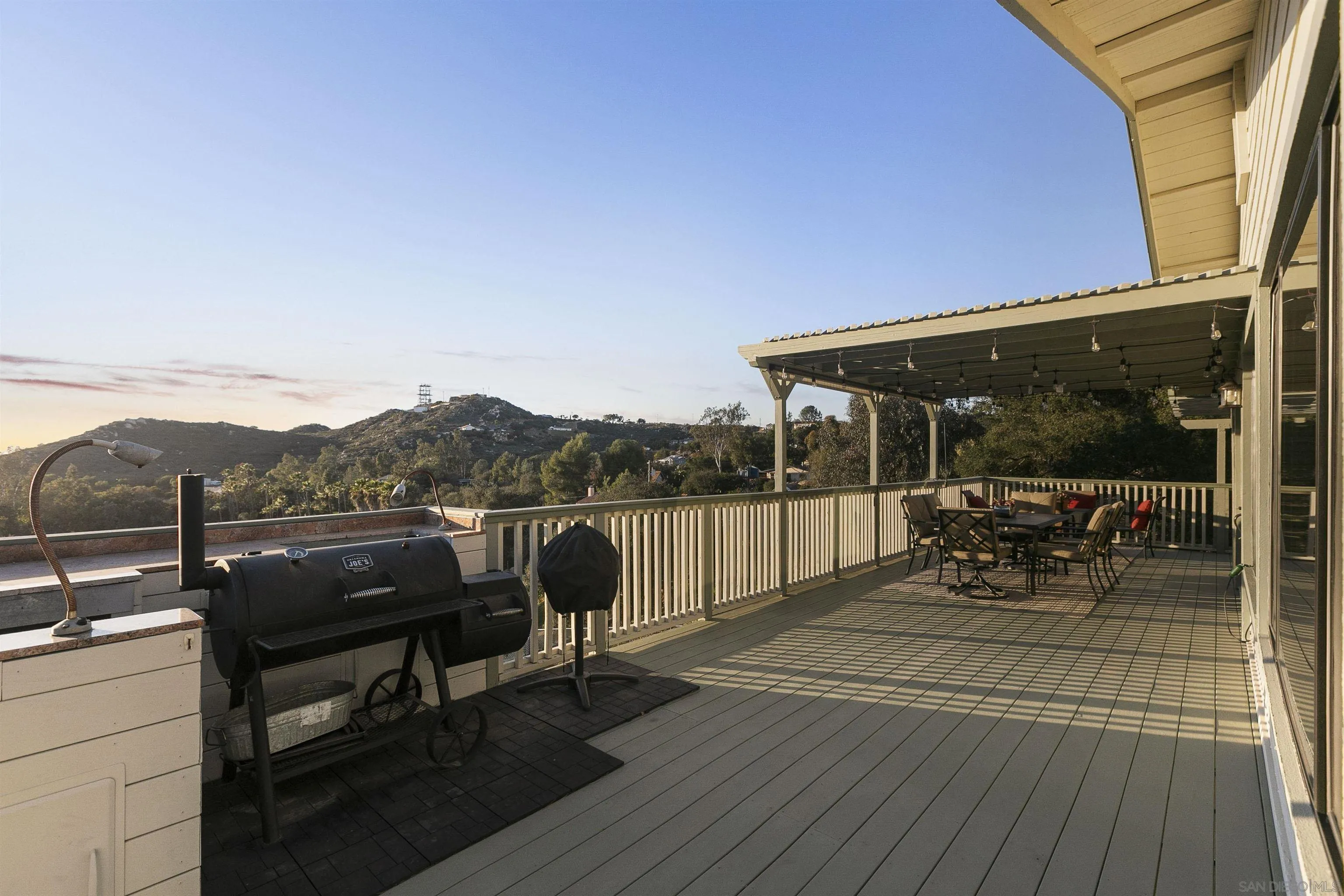 2505 Suncrest Boulevard El Cajon, CA 92021 - Photo 26 of 45 a terrace with outdoor seating and trees