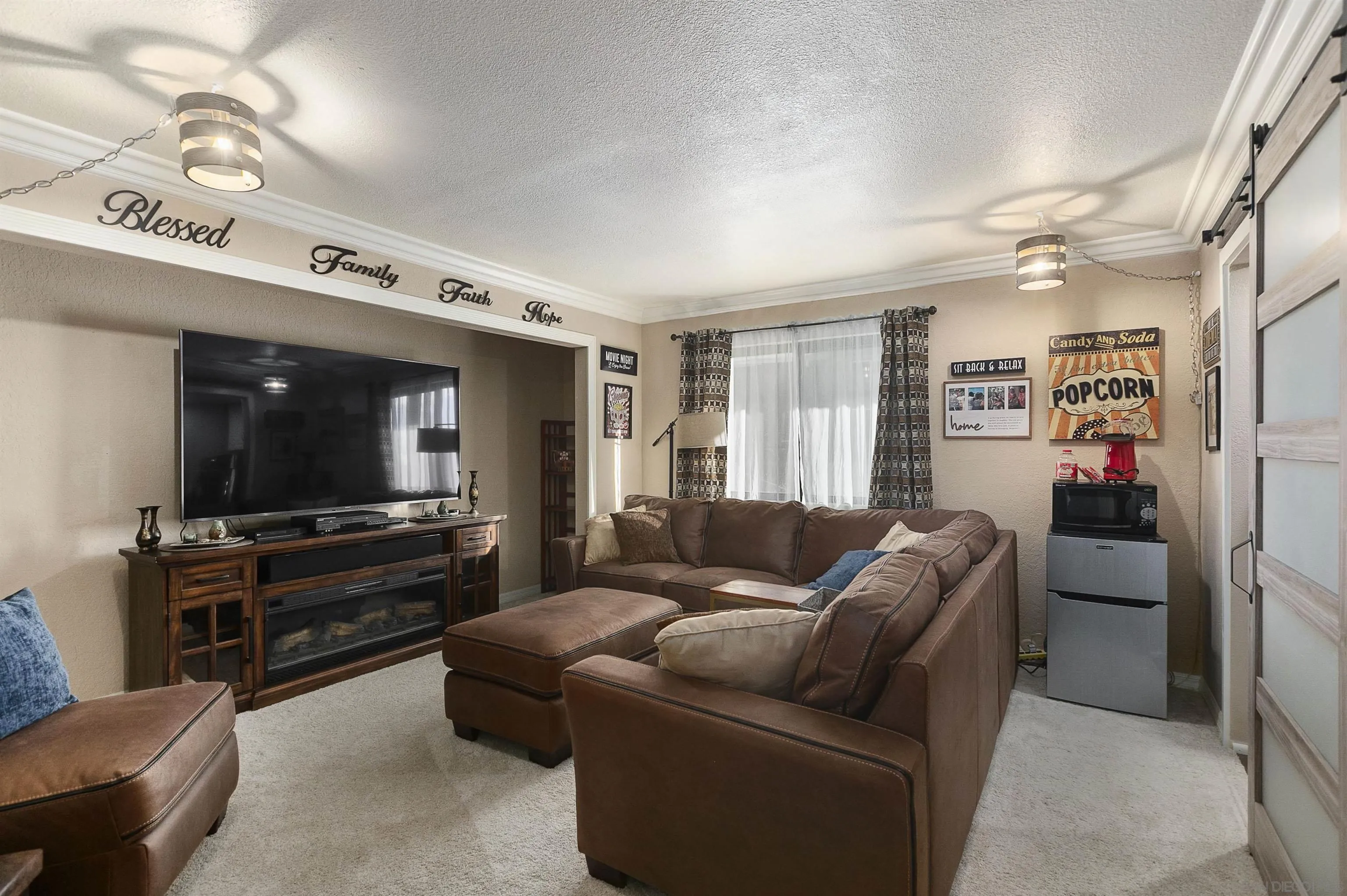 2505 Suncrest Boulevard El Cajon, CA 92021 - Photo 30 of 45 a living room with furniture and a flat screen tv