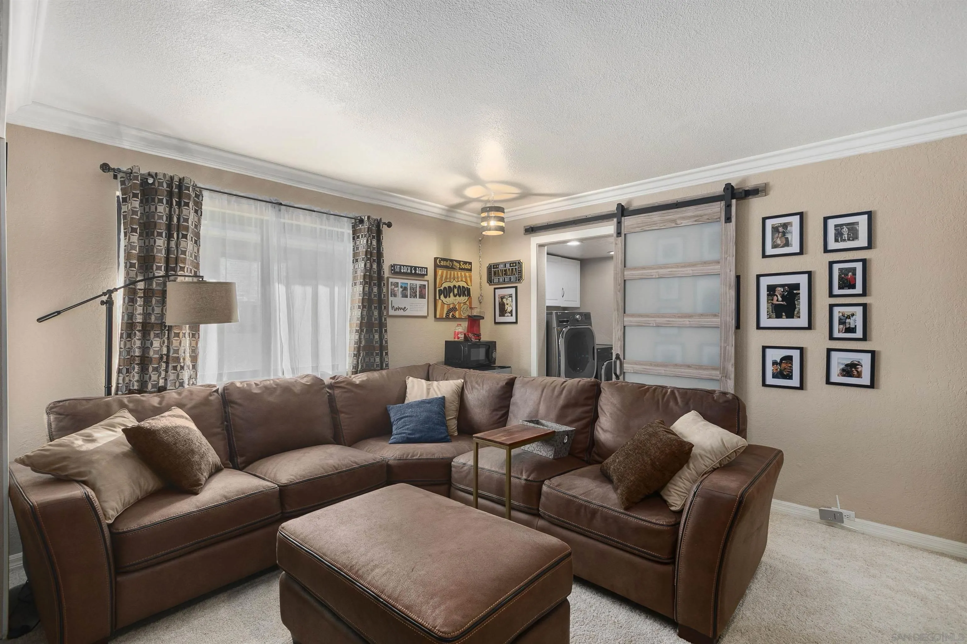 2505 Suncrest Boulevard El Cajon, CA 92021 - Photo 31 of 45 a living room with furniture and a large window