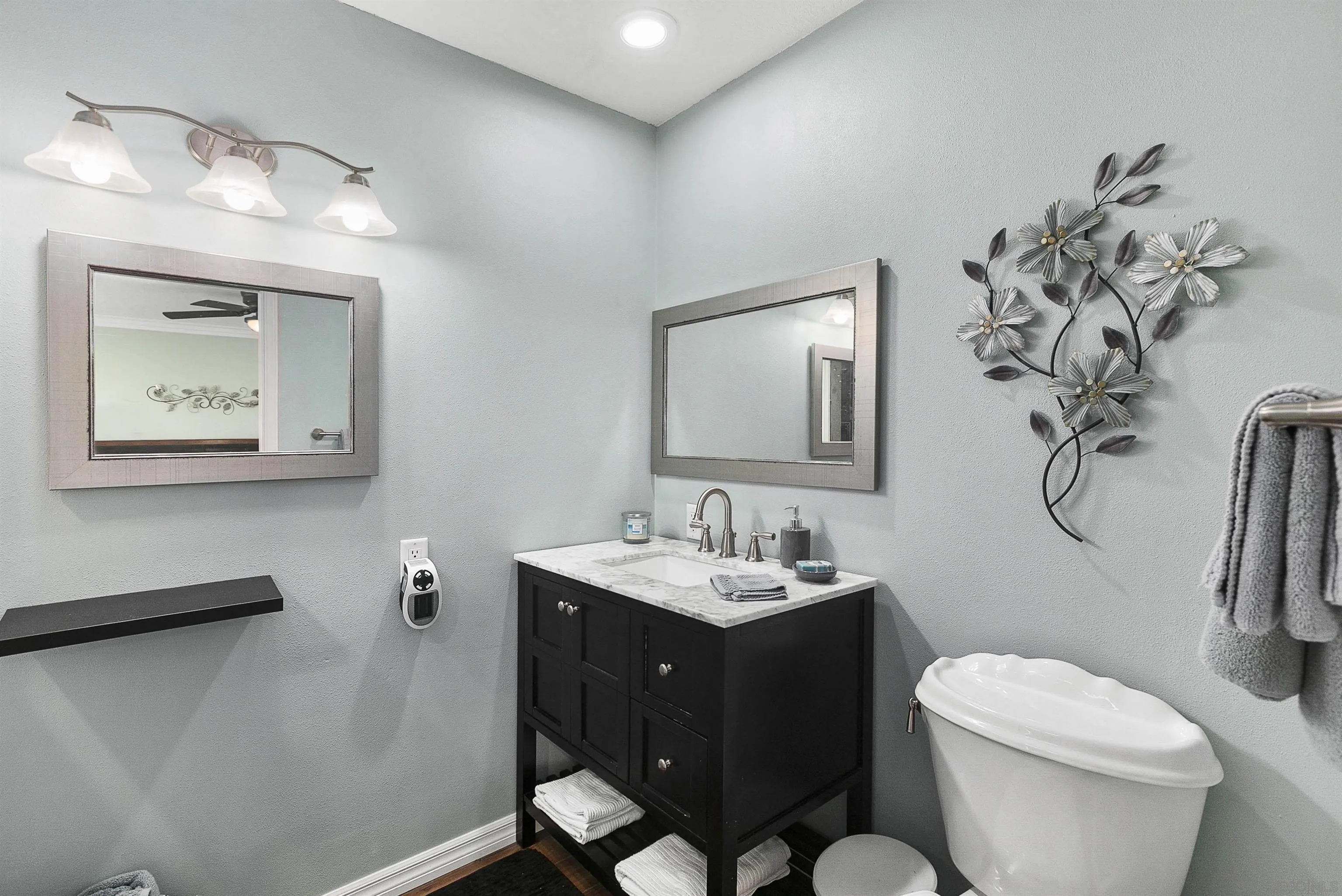 2505 Suncrest Boulevard El Cajon, CA 92021 - Photo 38 of 45 a bathroom with a toilet sink and mirror