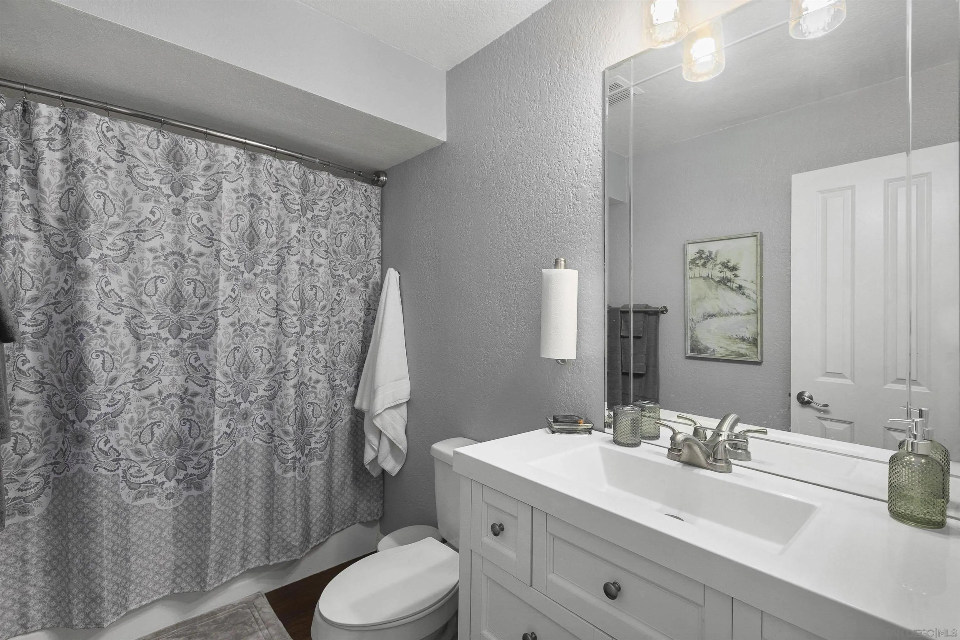 2505 Suncrest Boulevard El Cajon, CA 92021 - Photo 39 of 45 a bathroom with a sink and a mirror