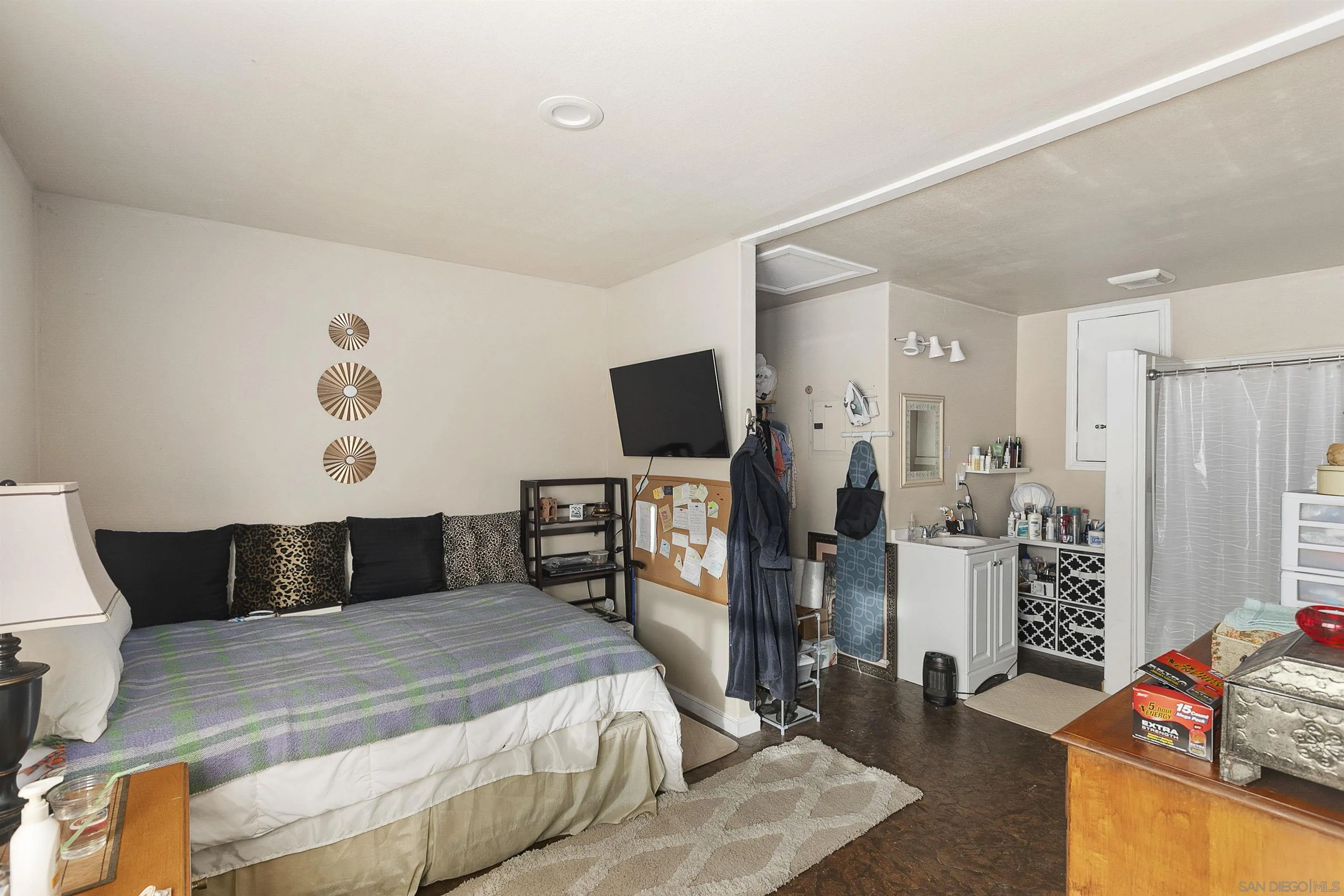 2505 Suncrest Boulevard El Cajon, CA 92021 - Photo 43 of 45 a bedroom with a bed and flat tv screen on the dresser