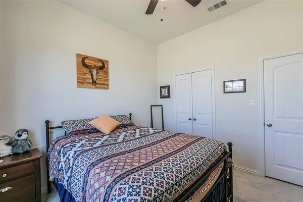 a bedroom with furniture and a chandelier