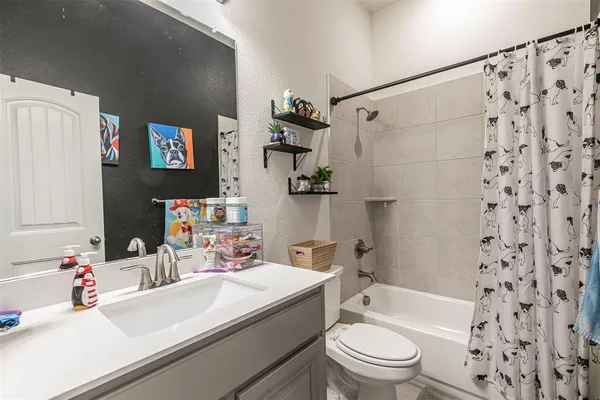a kitchen with stainless steel appliances granite countertop a stove and a refrigerator
