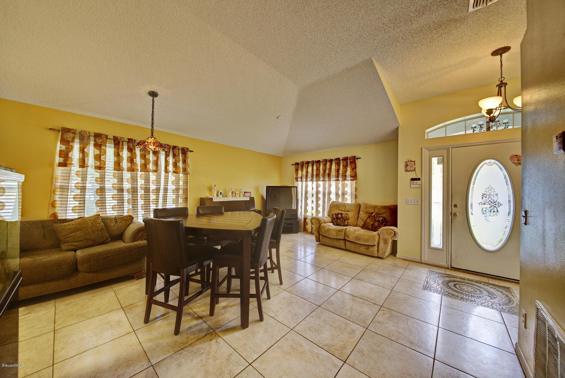 4851 Decatur Circle Melbourne, FL 32934 - Photo 4 of 27 Tile Floors in Livng & Dining