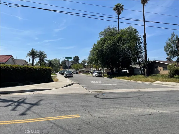 a view of a road with a building in the background