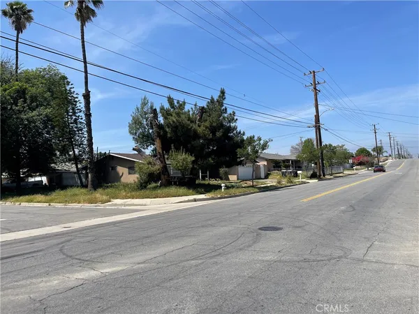 a street view with a building in the background