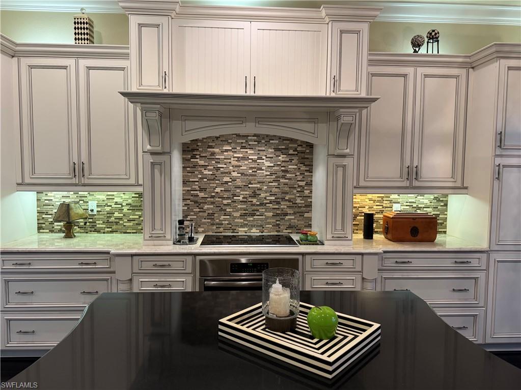 3200 Atlantic Circle Naples, FL 34119 - Photo 16 of 41 a kitchen with a table and chairs