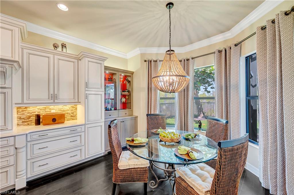 3200 Atlantic Circle Naples, FL 34119 - Photo 19 of 41 a outdoor dining space with furniture window and wooden floor