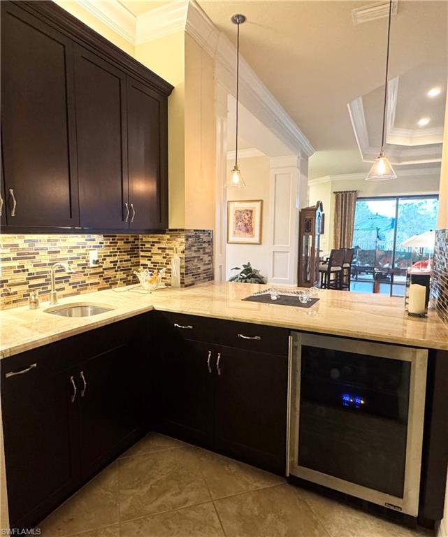 3200 Atlantic Circle Naples, FL 34119 - Photo 22 of 41 a kitchen with a sink and a wooden cabinets
