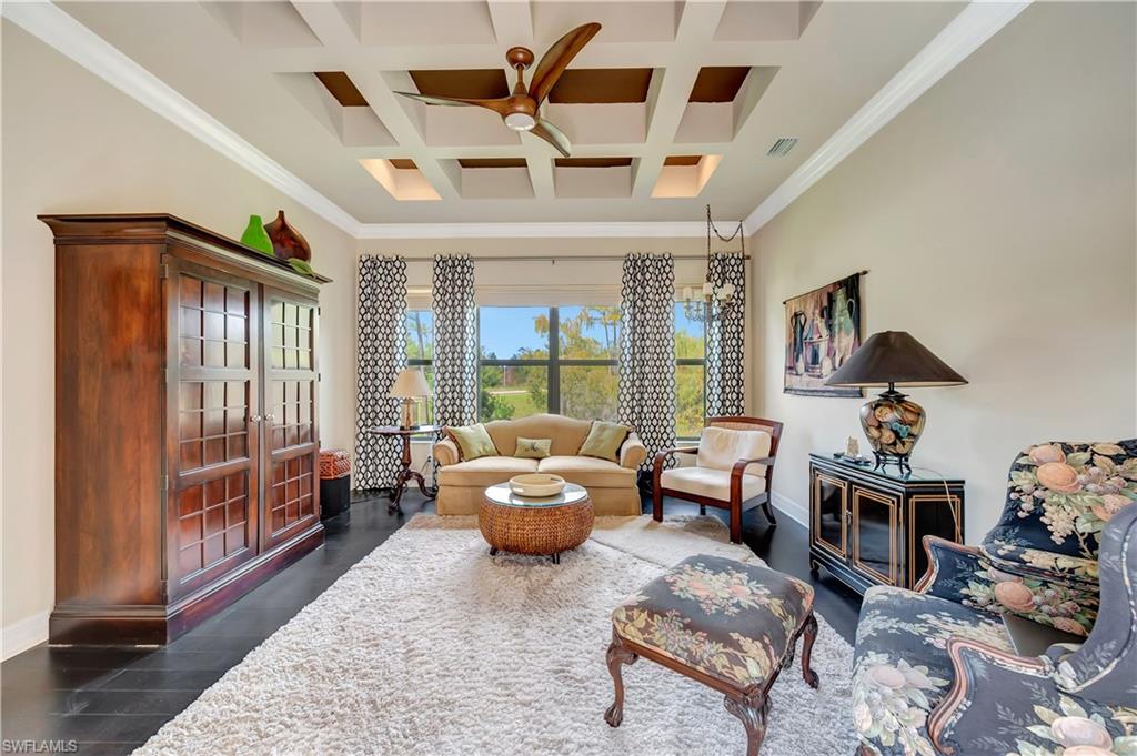 3200 Atlantic Circle Naples, FL 34119 - Photo 23 of 41 a living room with furniture and a fireplace