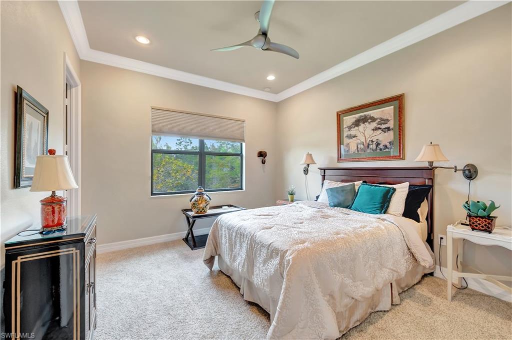 3200 Atlantic Circle Naples, FL 34119 - Photo 30 of 41 a bed sitting in a bedroom next to a window