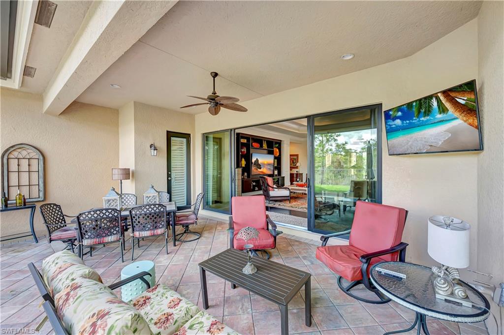 3200 Atlantic Circle Naples, FL 34119 - Photo 35 of 41 a living room with furniture and a large window
