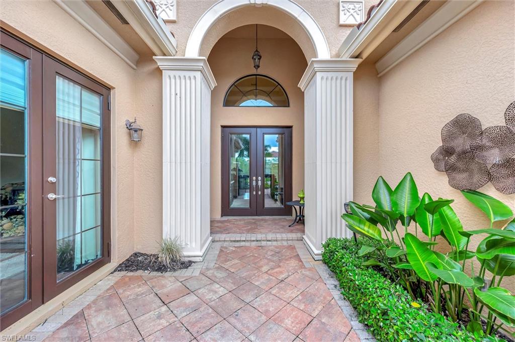 3200 Atlantic Circle Naples, FL 34119 - Photo 36 of 41 a front view of a house with garden