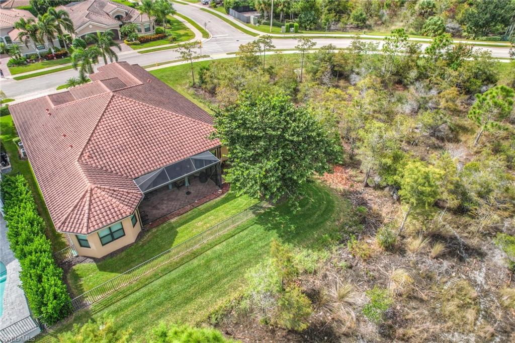 3200 Atlantic Circle Naples, FL 34119 - Photo 41 of 41 a view of a backyard with plants and wooden fence