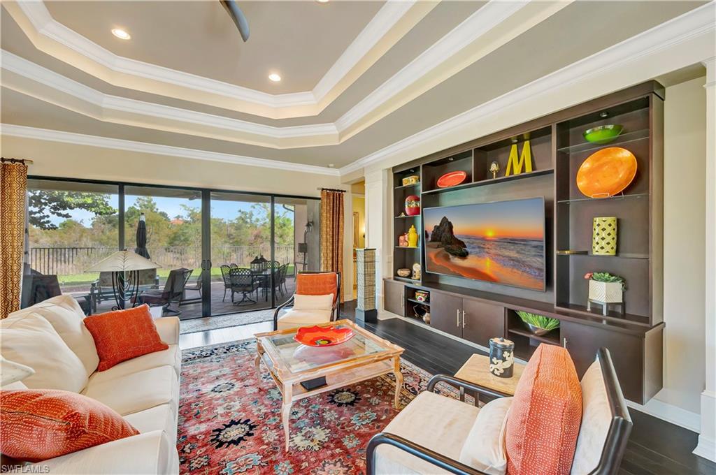 3200 Atlantic Circle Naples, FL 34119 - Photo 5 of 41 a living room with furniture and a flat screen tv