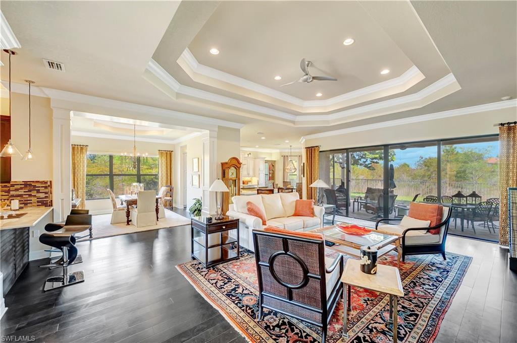 3200 Atlantic Circle Naples, FL 34119 - Photo 6 of 41 a living room with furniture and a large window