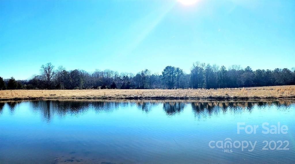 3100 Old Monroe Marshville Road Wingate, NC 28174 - Photo 4 of 15 a view of a lake with houses