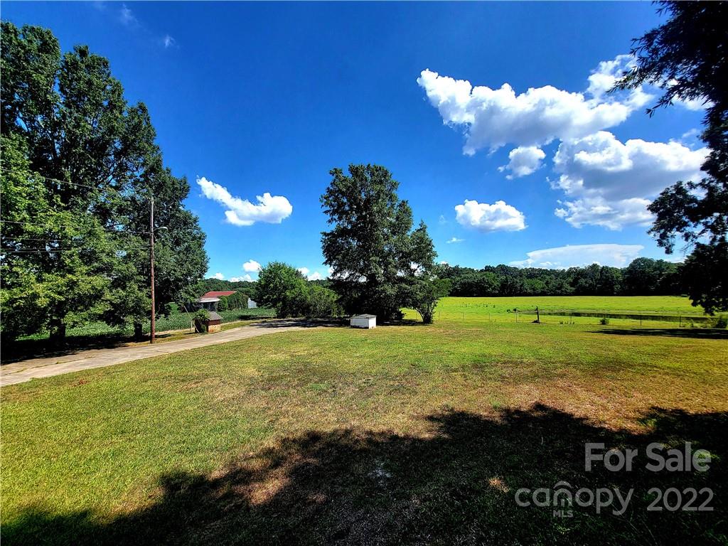 3100 Old Monroe Marshville Road Wingate, NC 28174 - Photo 7 of 15 a view of a golf course with a lake