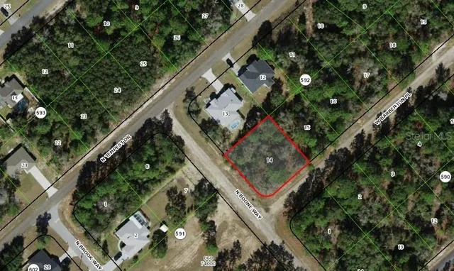 an aerial view of a residential houses with street