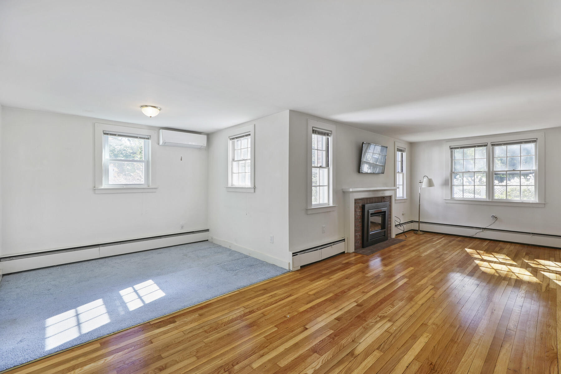 30 Davis Road Falmouth, MA 02540 - Photo 17 of 38 a view of an empty room with window and wooden floor
