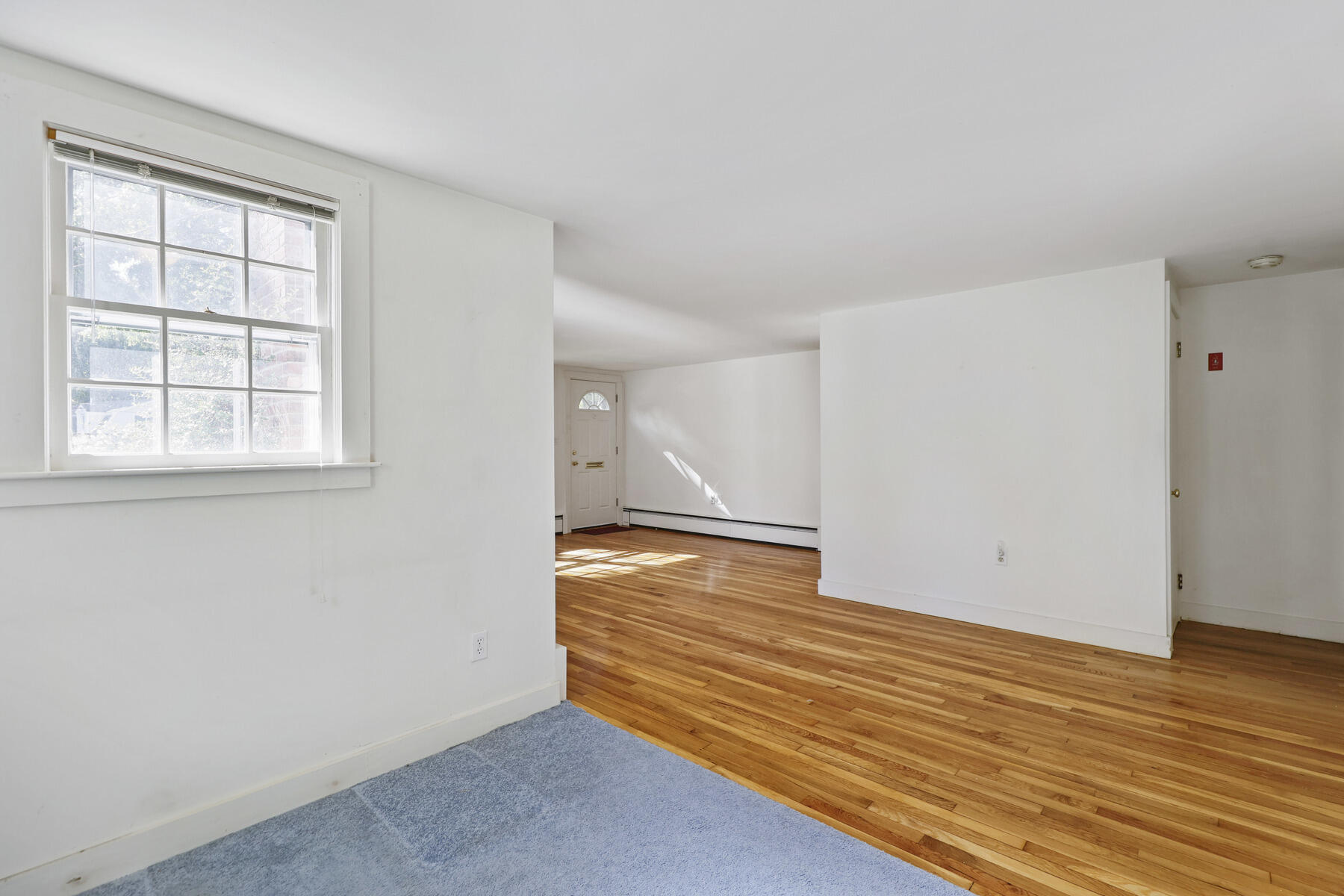 30 Davis Road Falmouth, MA 02540 - Photo 18 of 38 an empty room with wooden floor and window