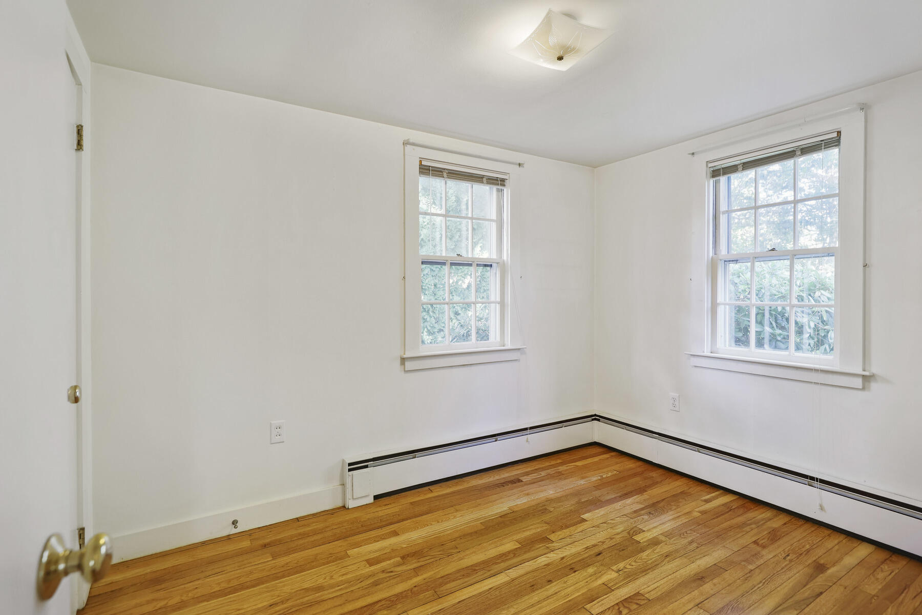 30 Davis Road Falmouth, MA 02540 - Photo 28 of 38 a view of empty room with wooden floor and fan